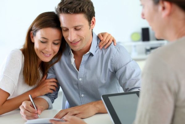The future parents signing the surrogacy contract - Joy of Life Surrogacy