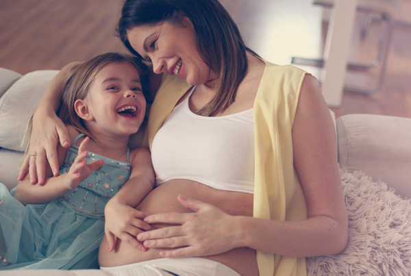 A mother hold on her little girl - Joy of Life Surrogacy