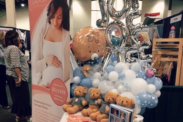 Teddy bear and Balloon on the table - Joy of Life Surrogacy