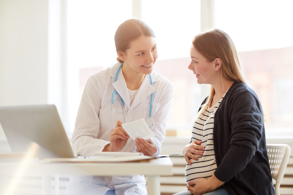 Surrogate mother talking to a doctor