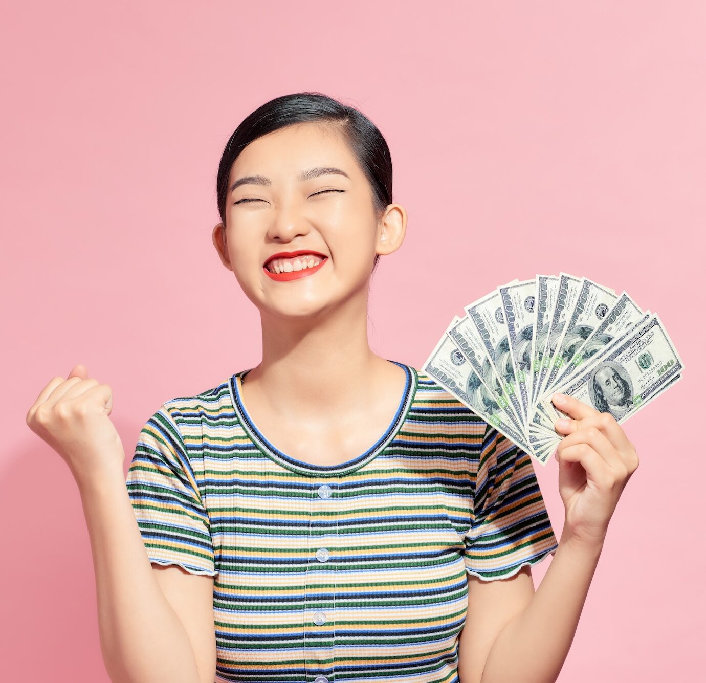 Young woman holding money